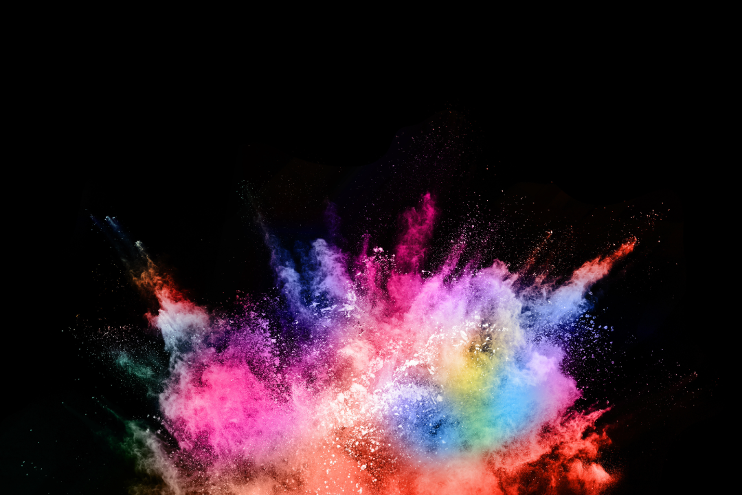 Explosion of coloured powder with a black background