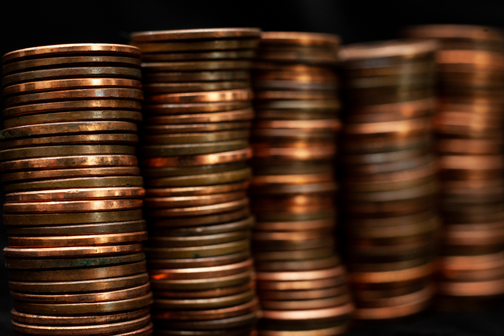 Multiple stacks of pennies. Close up view.